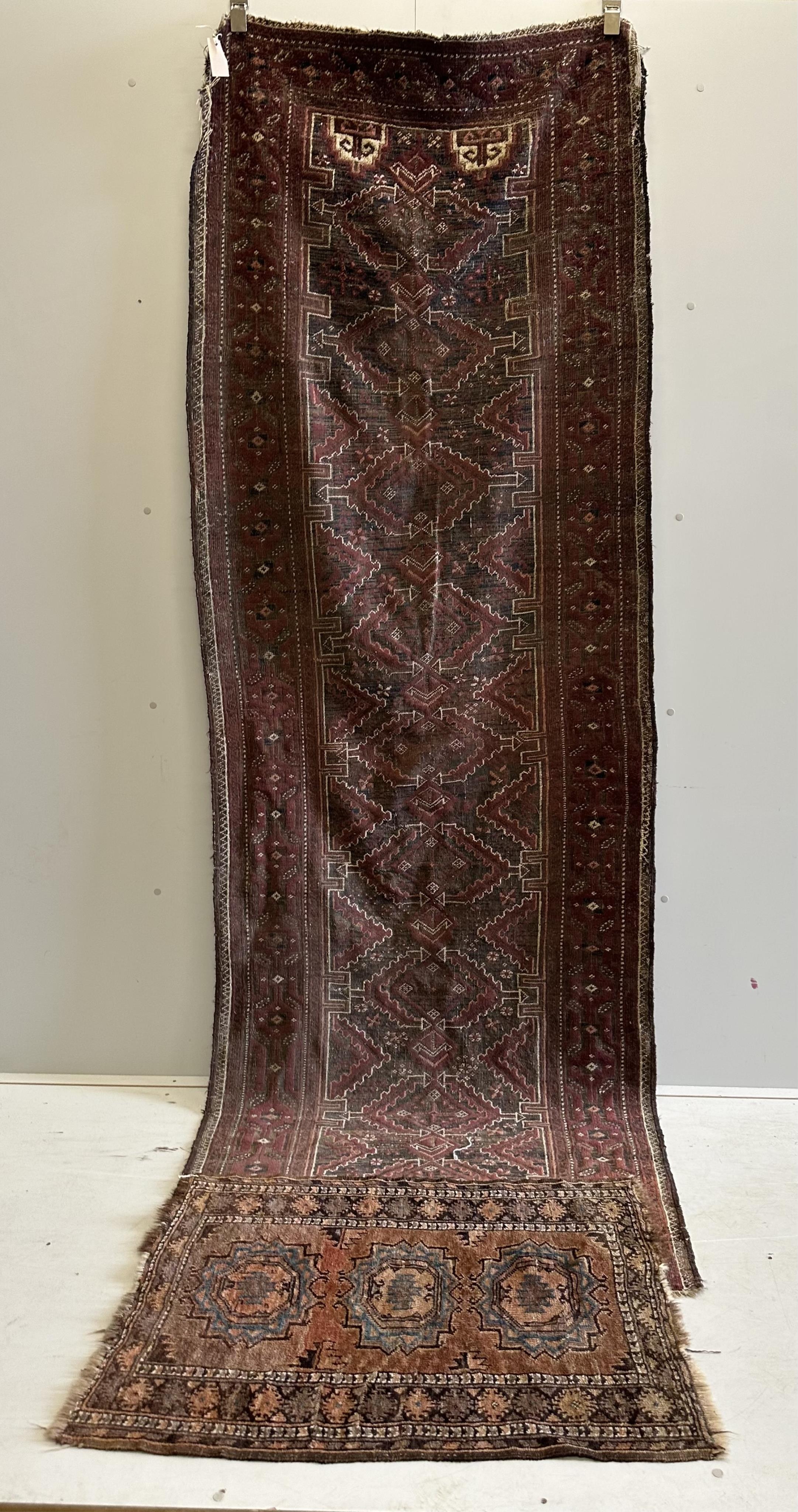 A Belouch runner and a Caucasian mat, larger 294 x 98cm. Condition - poor